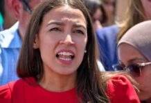 Socialists Revolt: AOC Branded ‘Too Moderate’ woman speaking passionately at outdoor event