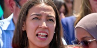 Socialists Revolt: AOC Branded ‘Too Moderate’ woman speaking passionately at outdoor event