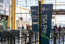 ICE Arrests Are Spreading Across Airports TSA PreCheck sign at airport security