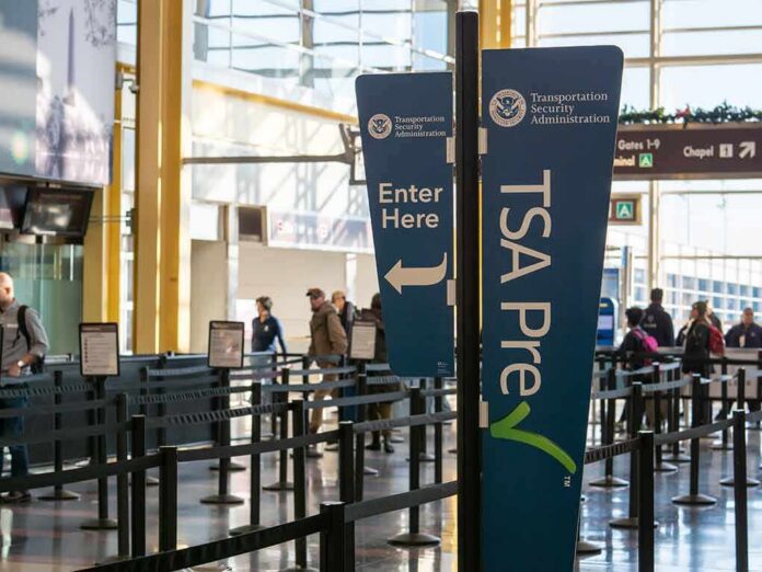 shutterstock_1549154468 TSA PreCheck sign at airport security