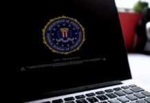 New Records Reignite Hunter Biden Laptop Fight Laptop screen displaying FBI seal