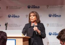 Death Threats Trigger Federal Bust Woman speaking at a podium with microphone