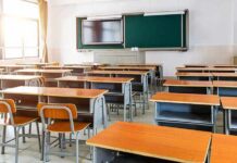 Mandatory Anti-Communism Lessons Land Empty classroom with rows of desks and a chalkboard
