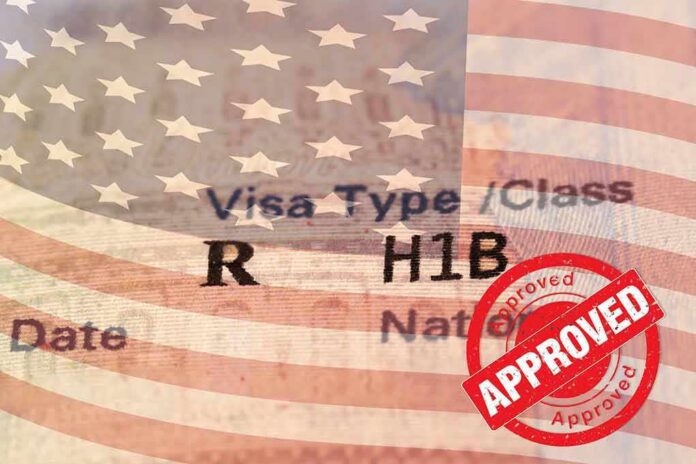 shutterstock_1822551422 H1B visa document with U.S. flag overlay and red Approved stamp