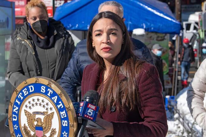 shutterstock_1912672120 Woman speaking at outdoor press event with microphones and seal