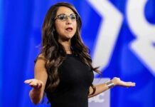 Lauren Boebert’s Son Faces Five Felony Charges Woman speaking on stage with arms outstretched