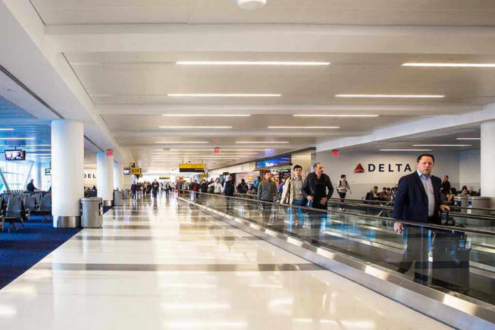 Airport terminal with passengers on a moving walkway