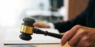 Pregnant Poisoning Horror Stuns Nashville Judge's hand holding a gavel over a sound block