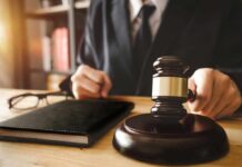 Federal Heat Targets Philly DA’s Office Judge with gavel striking sound block