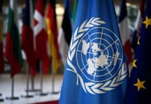 Iran vs. Ukraine Grips UN United Nations flag among international flags