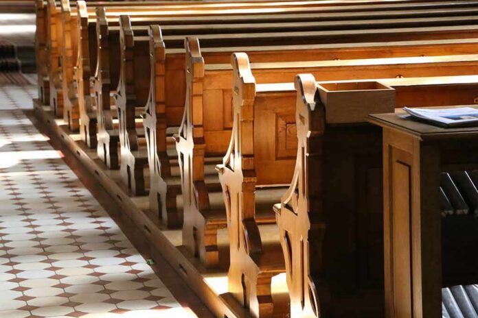 wooden church pews in sunlight