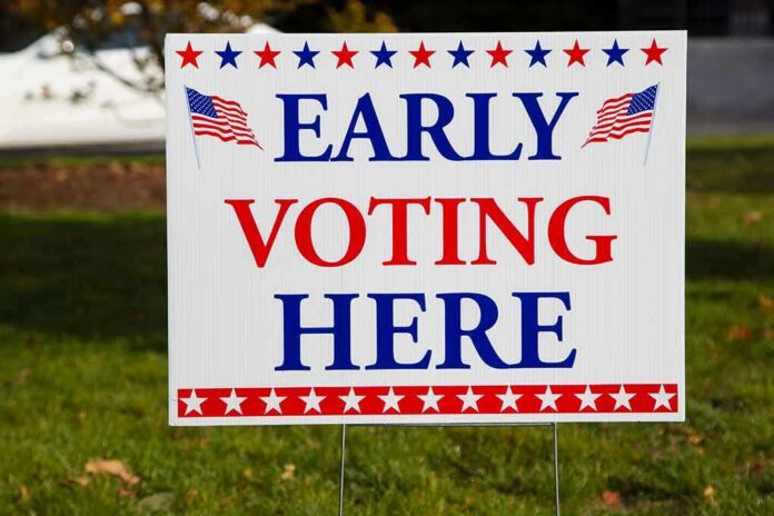 shutterstock_1210722322 Early voting sign on a lawn