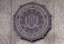 Kash Patel Crowns NBL legend At FBI FBI seal mounted on a granite wall