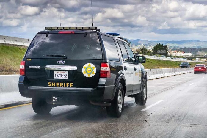 shutterstock_1352643686 Sheriff SUV driving on a highway