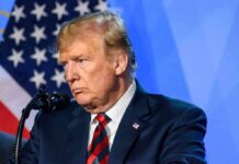 Trump Draws A Line On The AI Race man at podium speaking into microphone