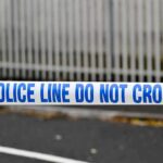 Police tape reading do not cross at a cordoned area