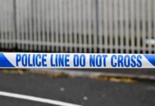 Police tape reading do not cross at a cordoned area