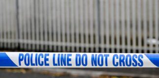 Police tape reading do not cross at a cordoned area