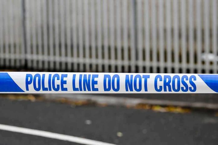 shutterstock_1389368342 Police tape reading do not cross at a cordoned area