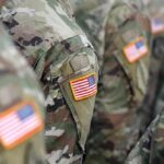 U.S. flag patches on camouflage military uniforms