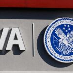VA logo and Department of Veterans Affairs seal on building wall