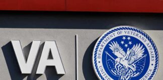 Air Force Maze Leaves Widow Hanging VA logo and Department of Veterans Affairs seal on building wall