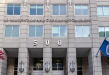Ohio Check-Ins Turned Into Shackles US government building facade with flags and number 500