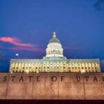 Utah State Capitol building at dusk with illuminated dome