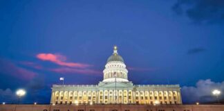 Stunning Lapse Alleged In Kirk Shooting Utah State Capitol building at dusk with illuminated dome