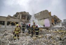 4 Americans Among The Dead at Acropolis Blast Firefighters search rubble of a partially collapsed building