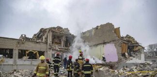 4 Americans Among The Dead at Acropolis Blast Firefighters search rubble of a partially collapsed building