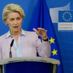 Speaker at podium during EU press conference