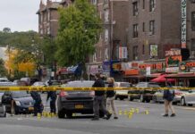 Georgia Apartment Shock – Torso In Tub Police investigate a taped-off urban street crime scene