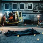 crime scene with body bag in alley