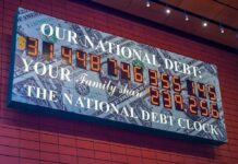 America’s Tab Explodes Past $40 Trillion national debt clock sign with digital numbers
