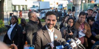 NYC Fury Over Lopsided Sympathy Zohran Mamdani speaks at a press conference; Julia Bacha is visible among the crowd