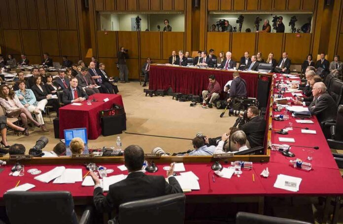 shutterstock_387761506-1 Patrick Leahy and Samuel Alito at a Senate hearing with committee and press present