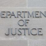 Department of Justice inscription on stone wall