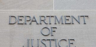Department of Justice inscription on stone wall
