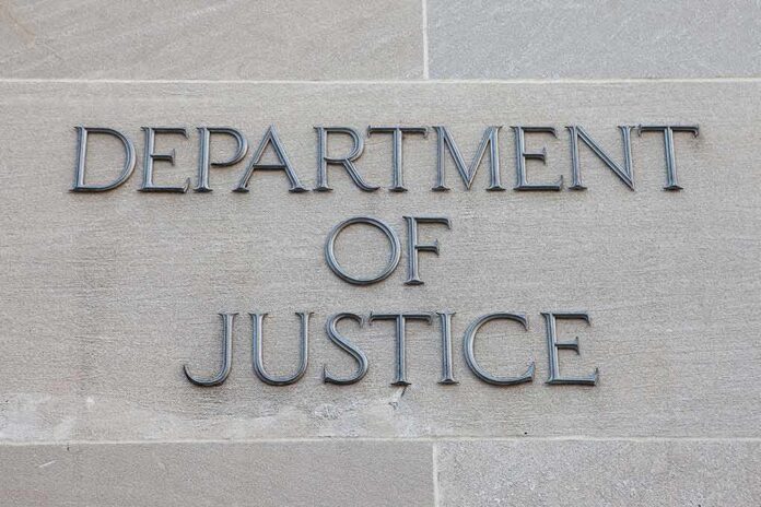 shutterstock_506478736 Department of Justice inscription on stone wall