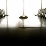 empty conference room with long table and chairs