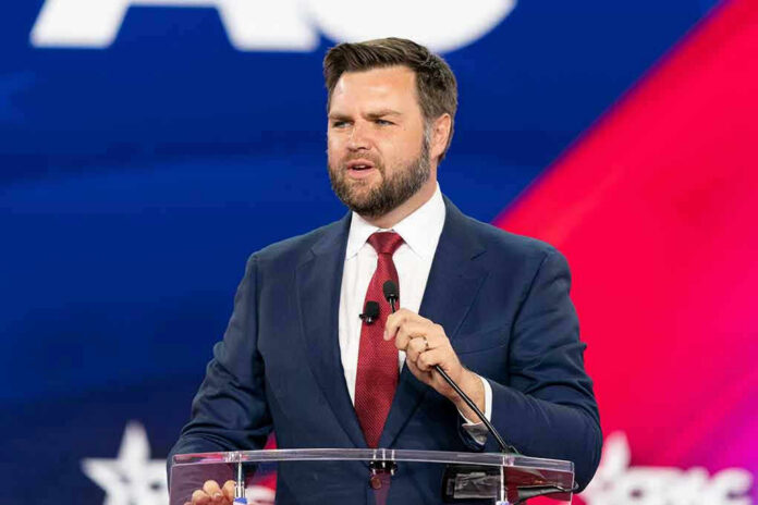c0e4d3fd-3b50-4cd9-b02f-4e9933d13d92_2186937103.jpeg man in suit speaking at a podium