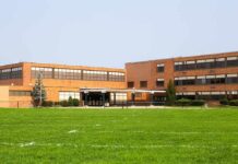 Blacklist Fears Explode In Florida Schools Brick school building with large windows and front entrance