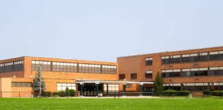 Blacklist Fears Explode In Florida Schools Brick school building with large windows and front entrance