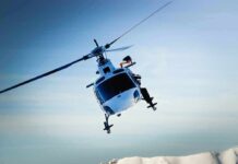 Aerial Takedown Freezes Tampa Streets helicopter banking over snowy mountains