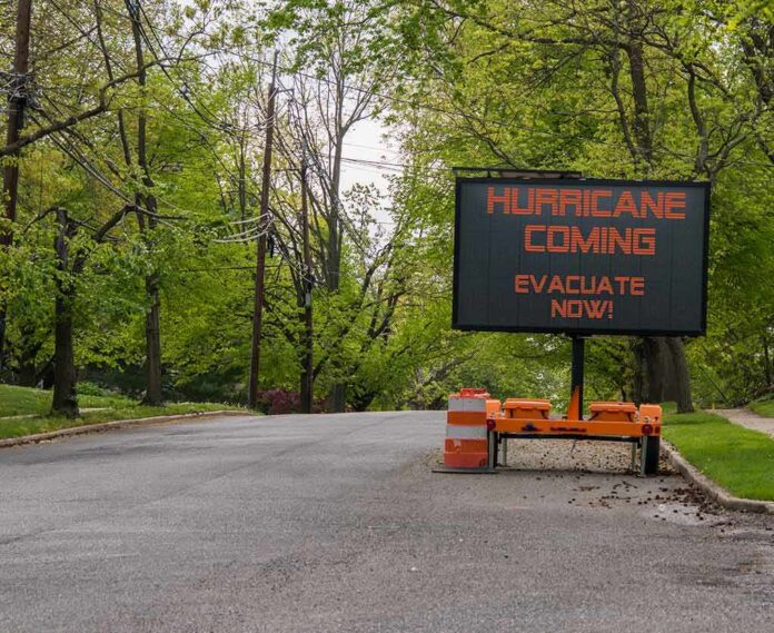 shutterstock_1166347549 Portable electronic road sign on a quiet tree-lined street