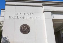 Michigan Hall of Justice exterior wall with state seal