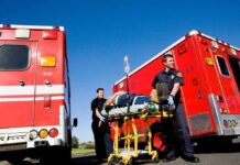 Systemwide Closures After Shocking Ejection Paramedics move a patient on a stretcher between red ambulances