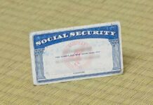 SS Checks Will be Slashed By 22% in 6 Years Social Security card on a textured surface