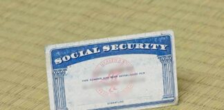 SS Checks Will be Slashed By 22% in 6 Years Social Security card on a textured surface